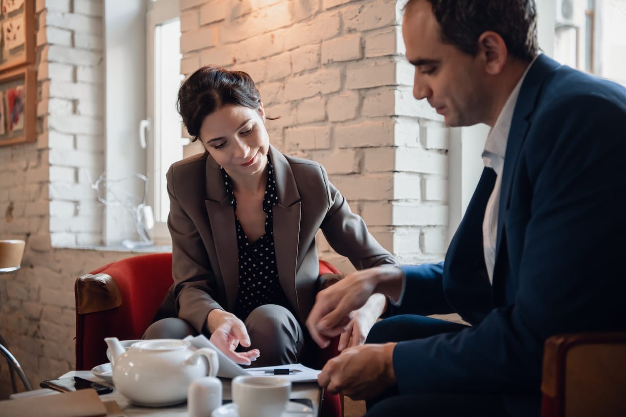 Business-team having a meeting at a coffee bar